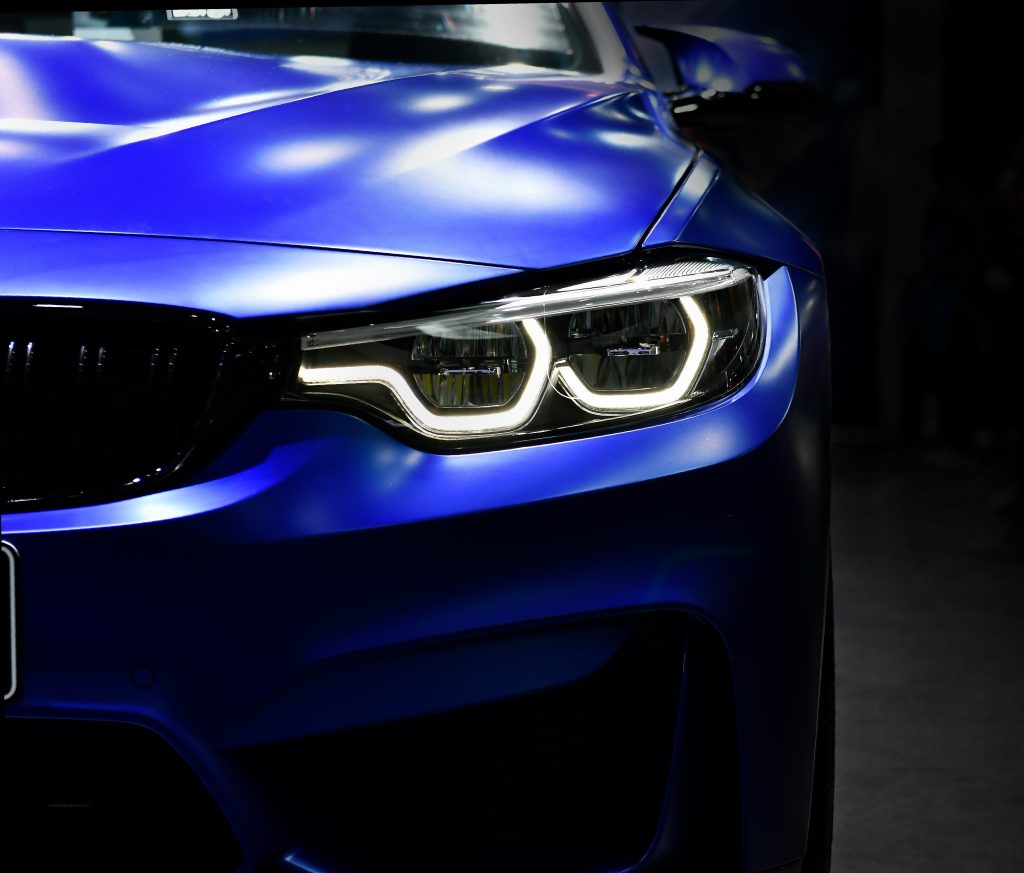 Front,View,Of,The,Led,Headlights,Modern,Blue,Car,On